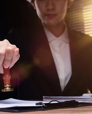 A notary stamping an important document